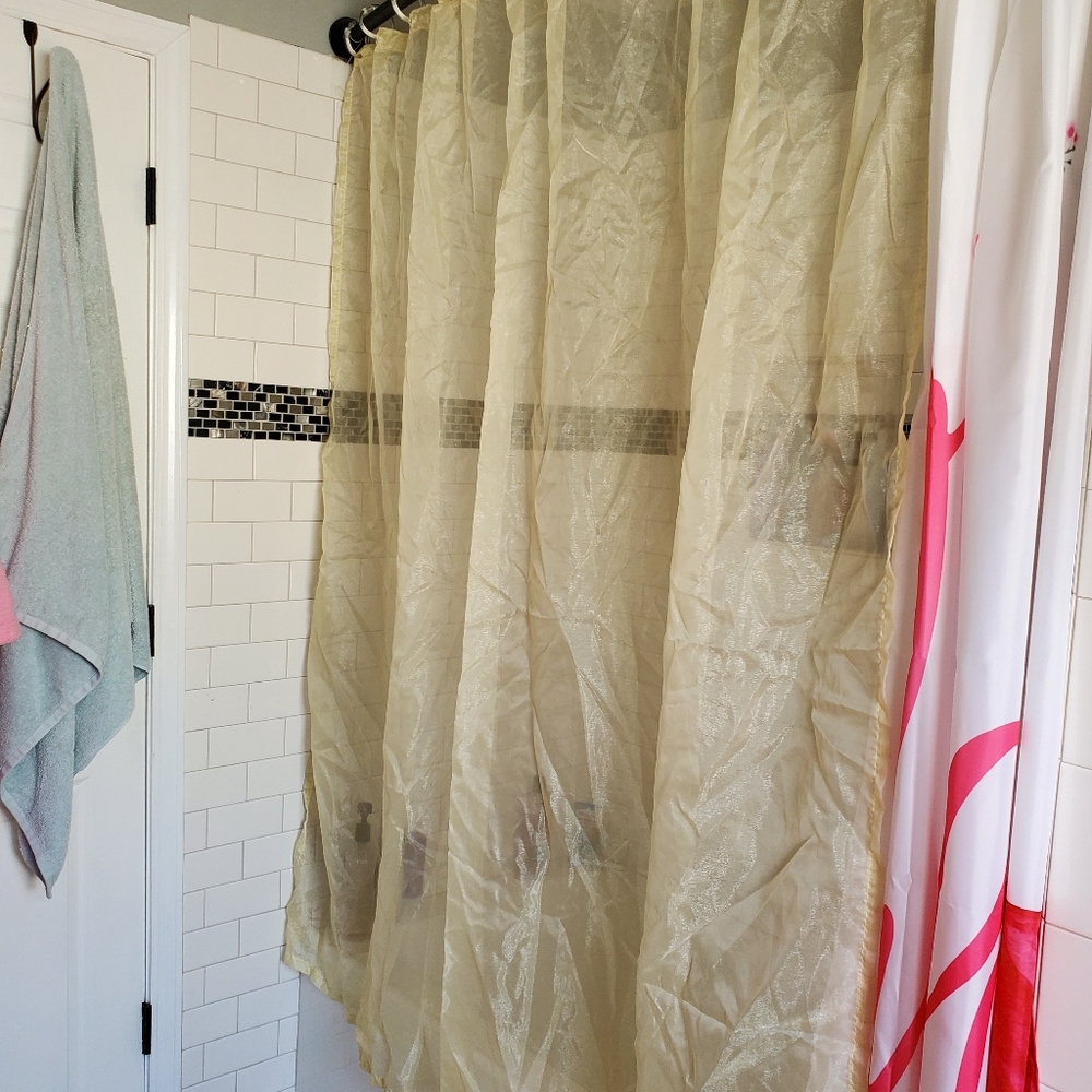 Light shimmery yellow shower curtain & clear round clips